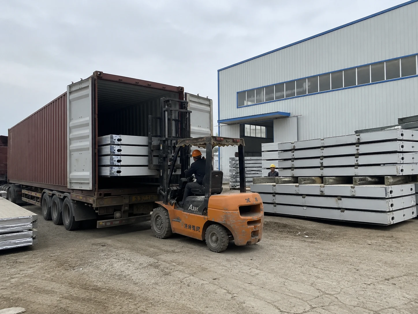 Flat pack container house components loaded for export shipping
