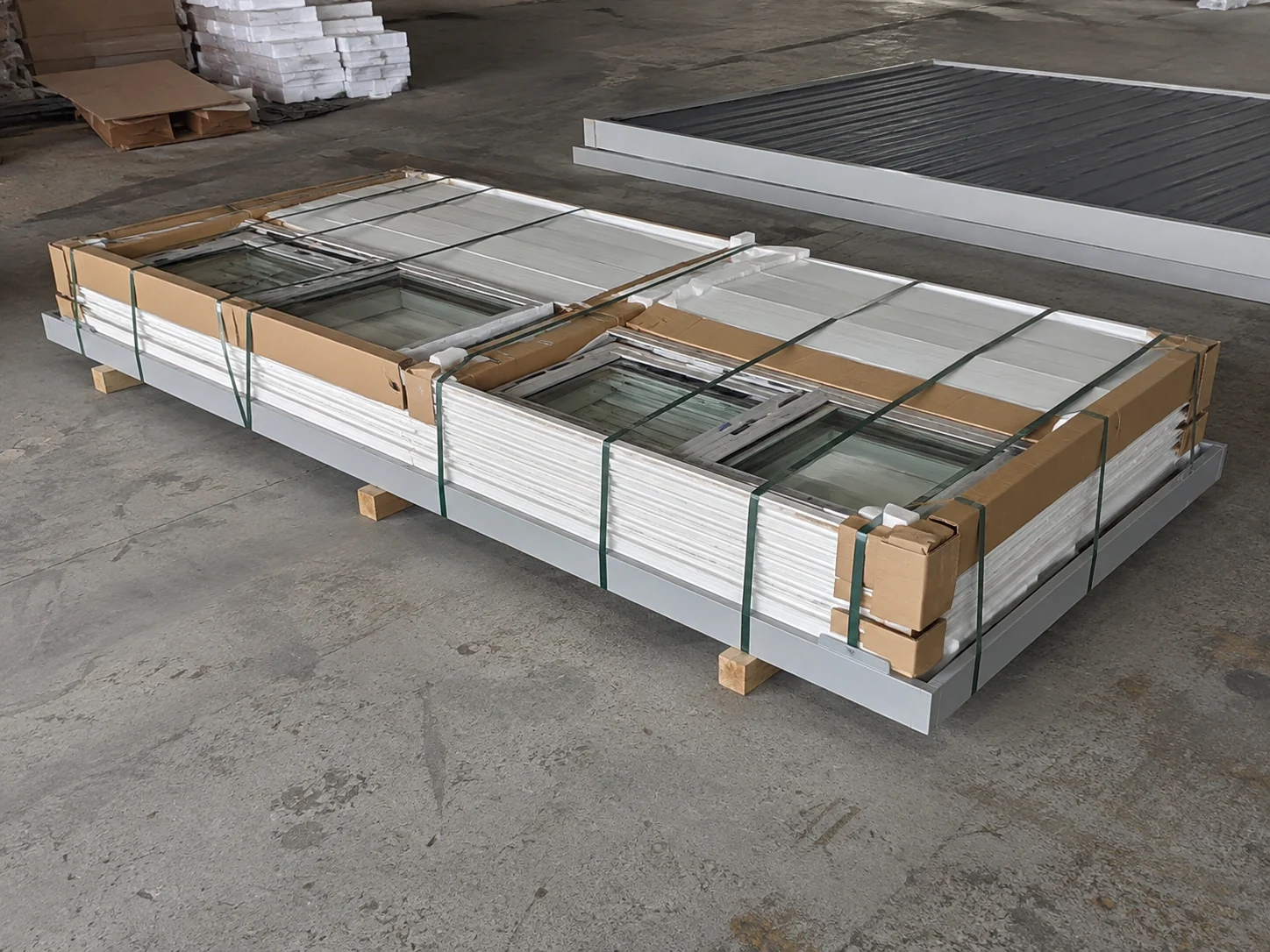 Illustrative protected flat pack bundle with panels and window components