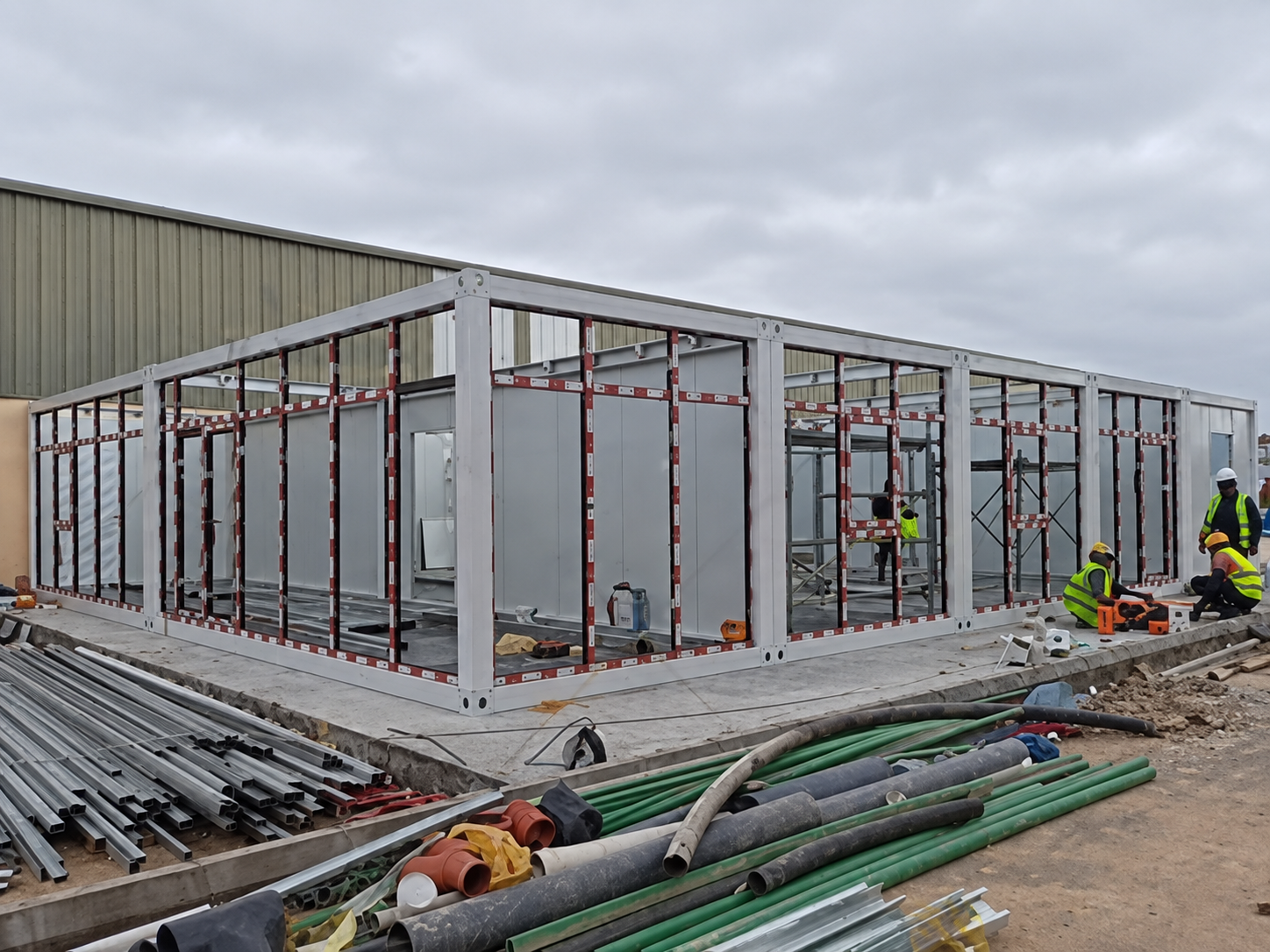 Ground-floor modular office wall and steel frame assembly at the Riyadh site
