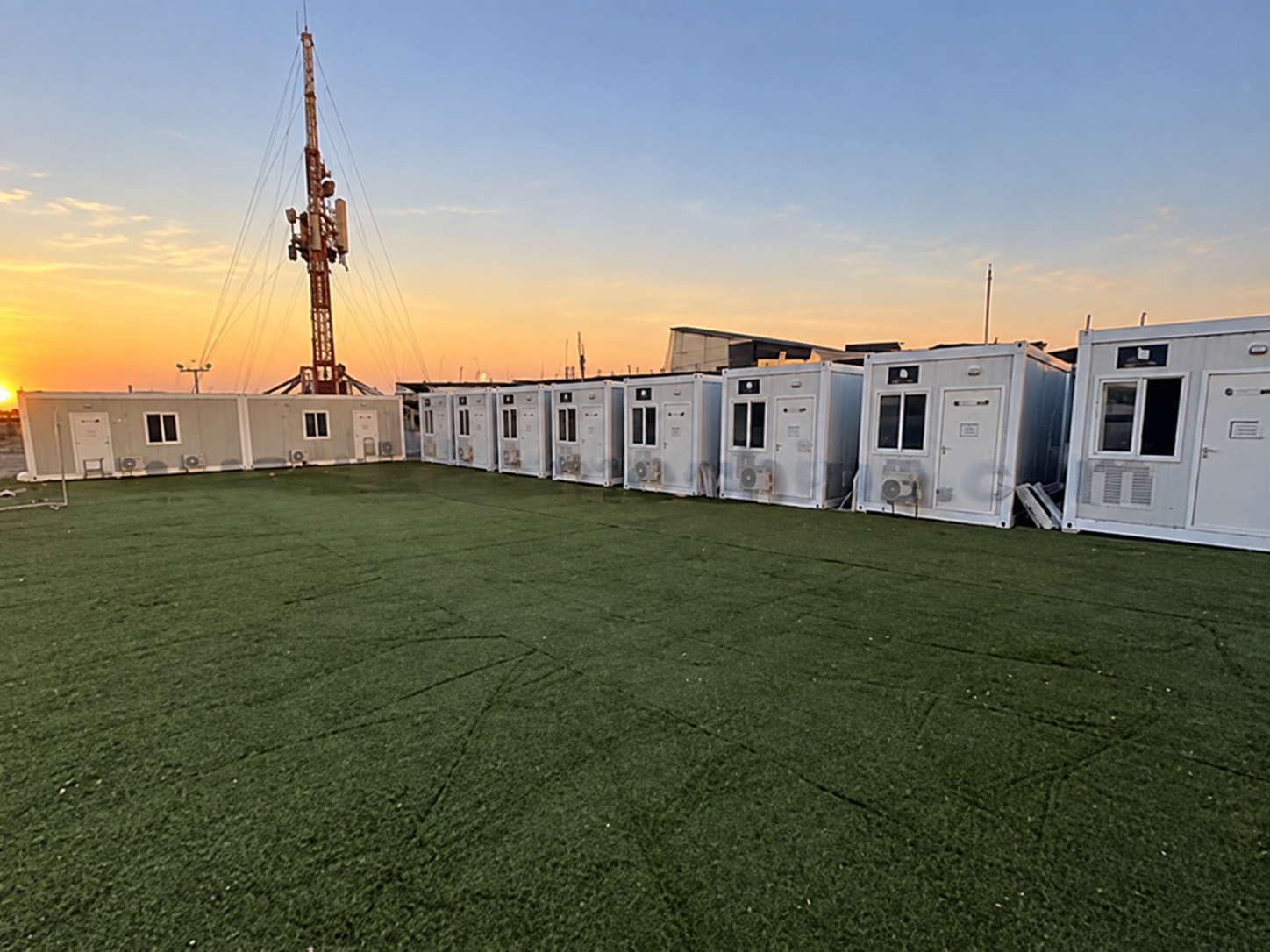 Extended row of site cabins across the event grounds