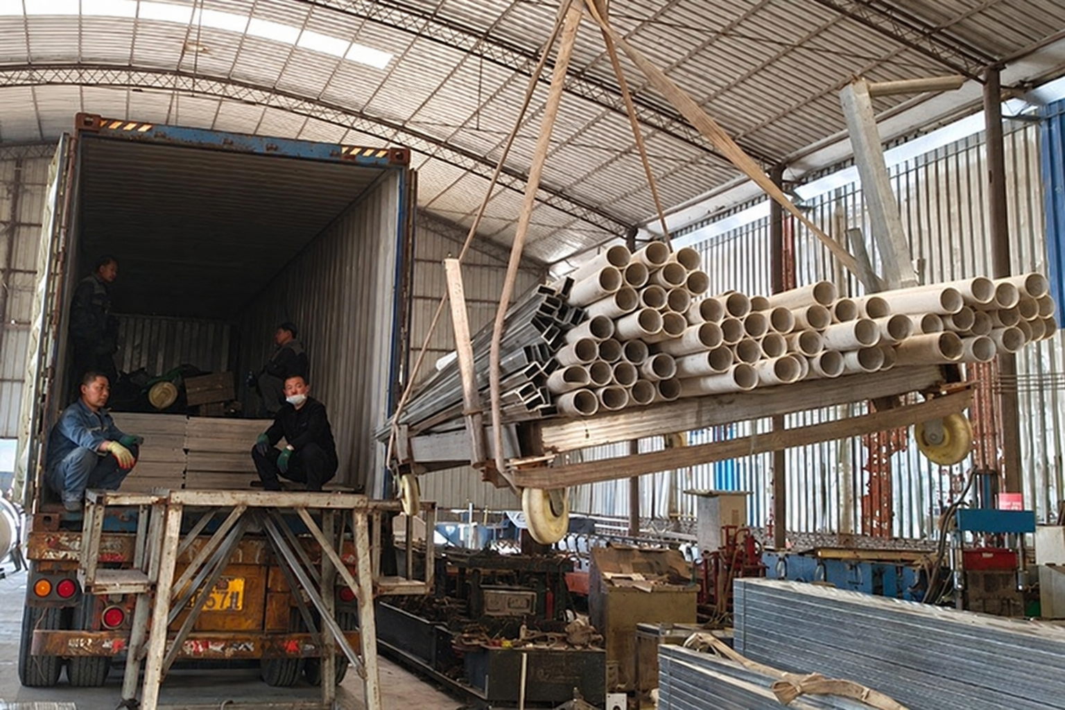 Archived reference image of metal components and pipes at the loading area