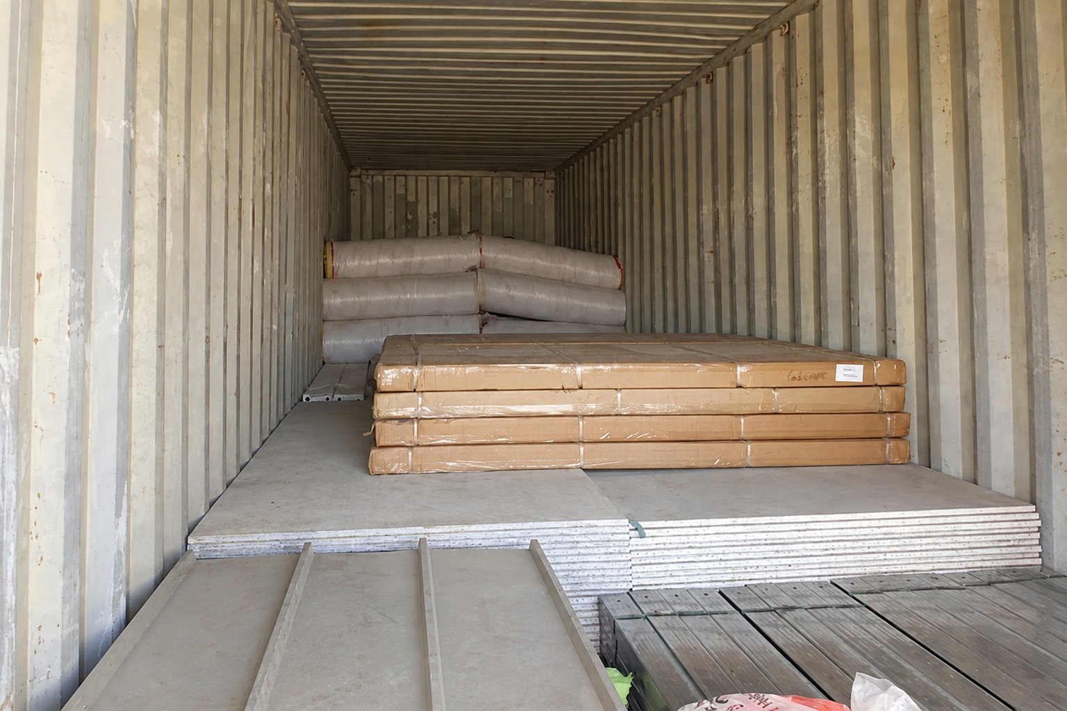Archived packing reference showing building materials inside a shipping container