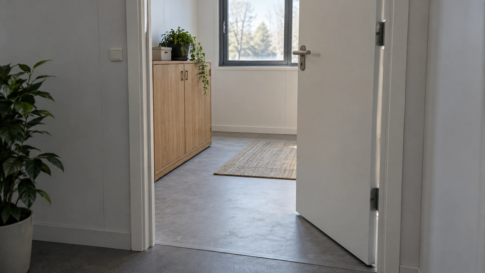 New concept illustration of a partly open modular-room door with an unobstructed entry area beside a storage unit.