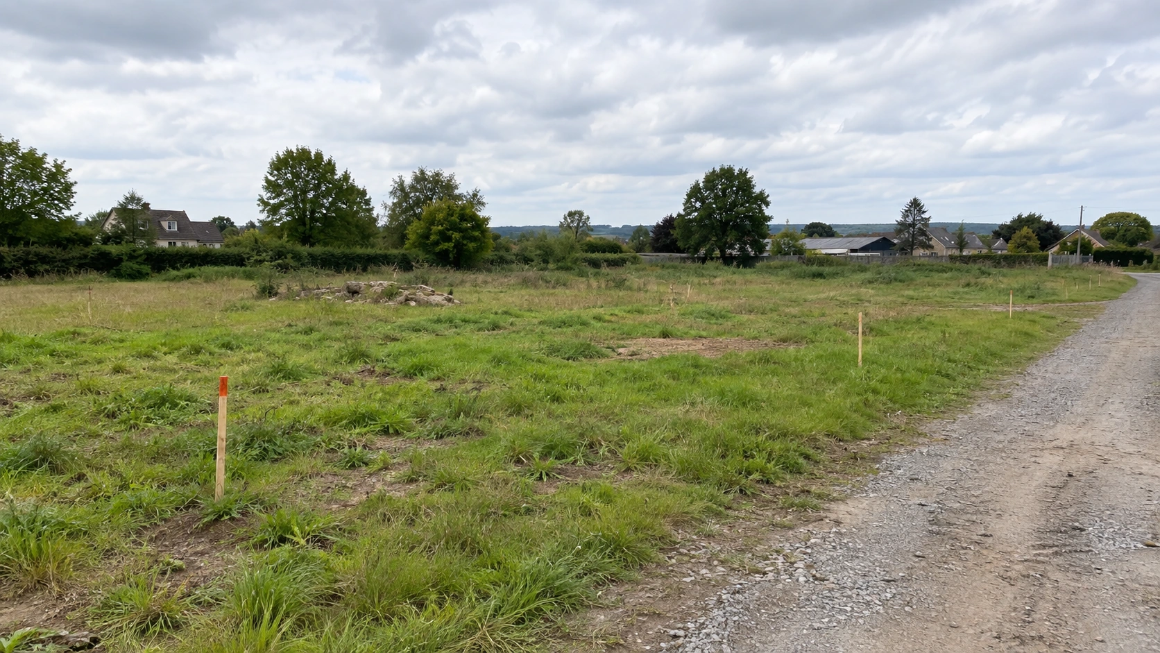 New concept illustration of an undeveloped project site with an access track and survey markers.