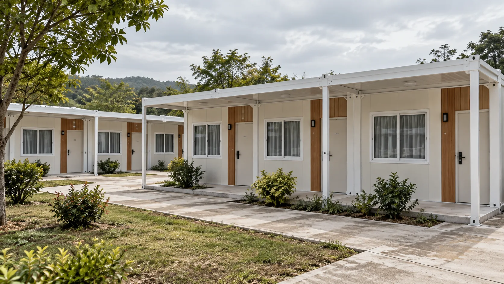 Modular hotel courtyard concept with low-rise guest rooms and garden paths