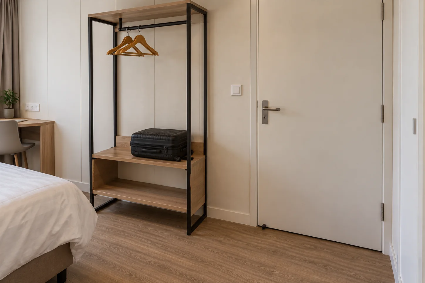 Guestroom entrance detail with wardrobe, luggage storage and door finish