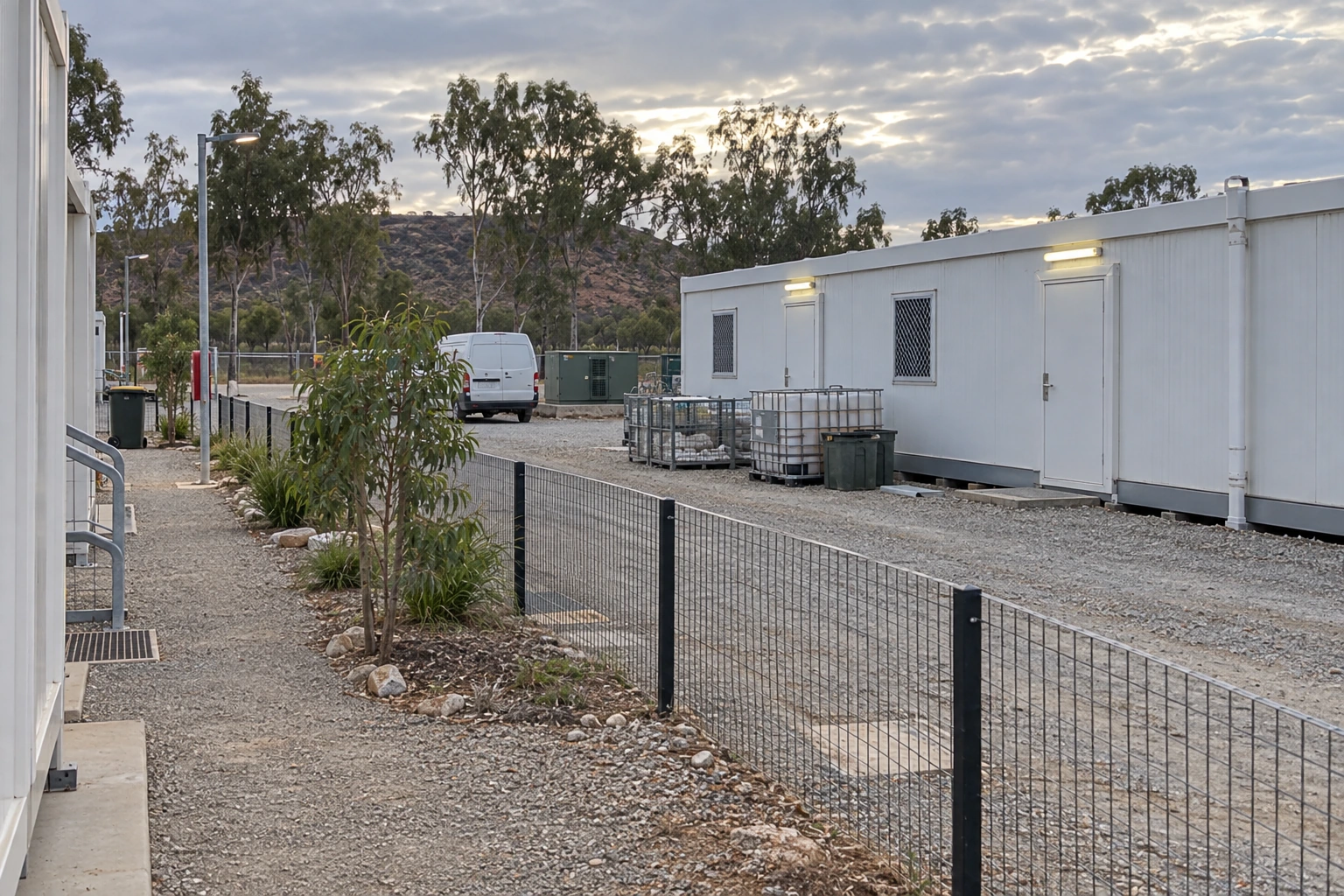 Illustrative scene: Pedestrian path separated from a camp service driveway