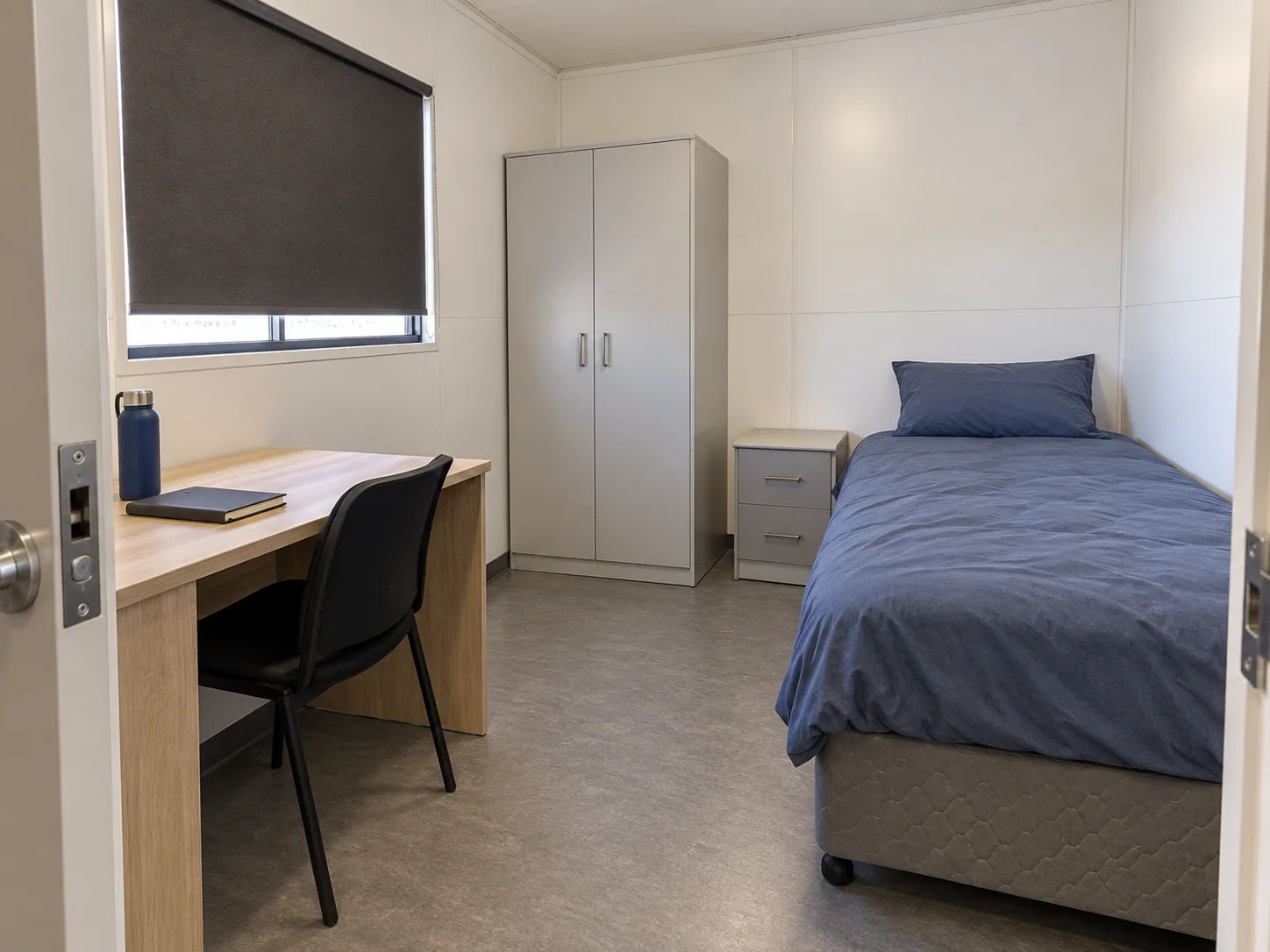 Concept private mining camp room with a bed, desk and personal storage
