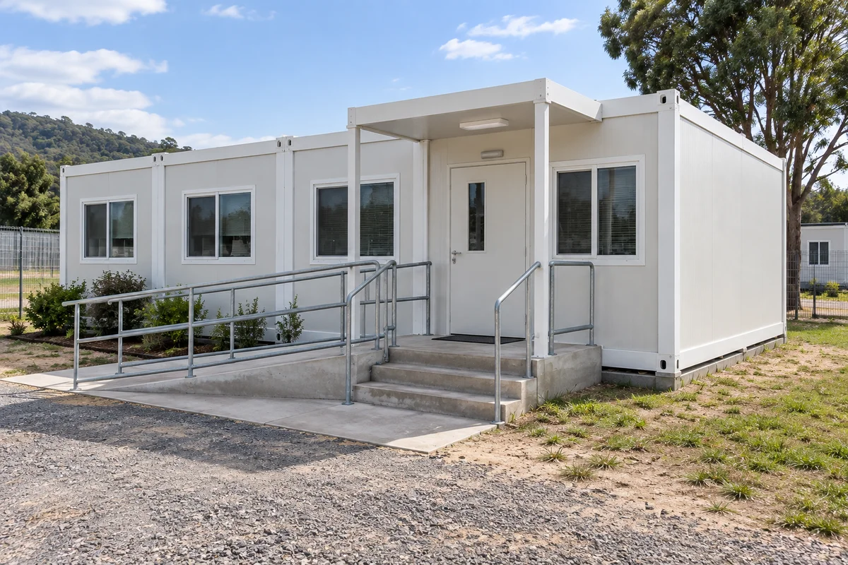 White modular clinic exterior with approach ramp and entrance