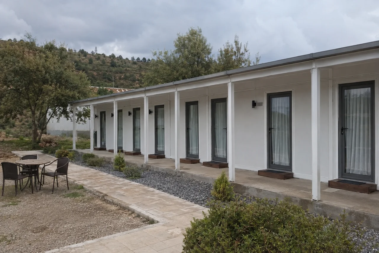 Illustrative modular guest-room wing with individual entrances and a sheltered porch