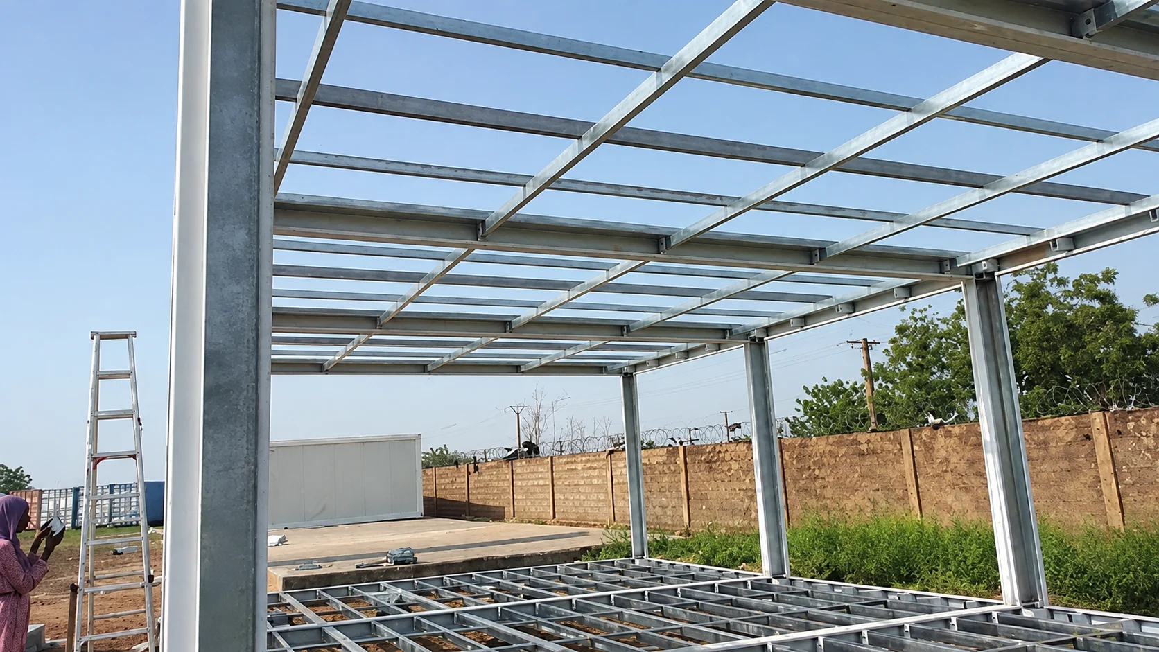 Interior view of steel roof and floor framing before wall panels
