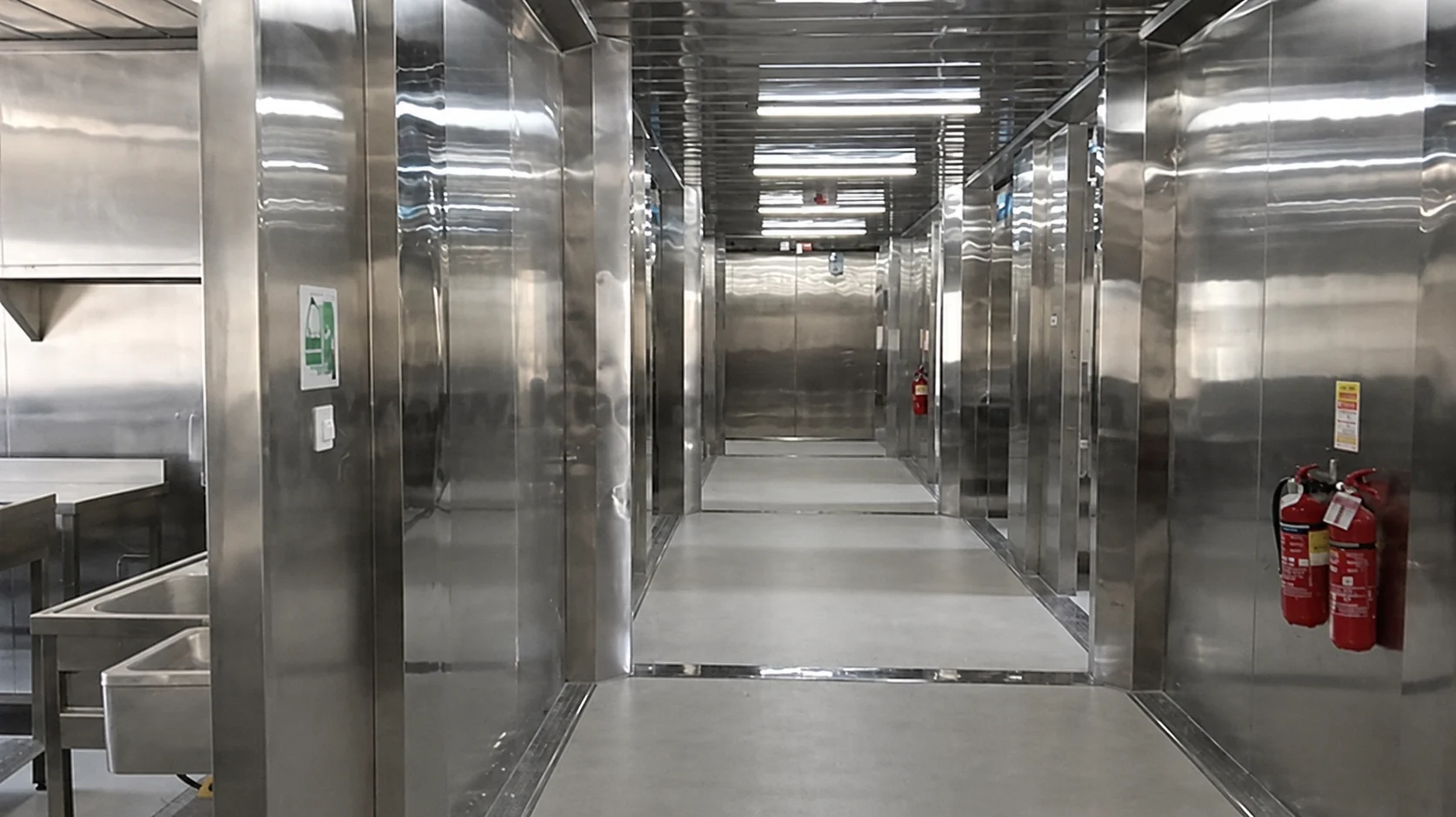 Stainless-steel corridor and service-room doors in the kitchen area