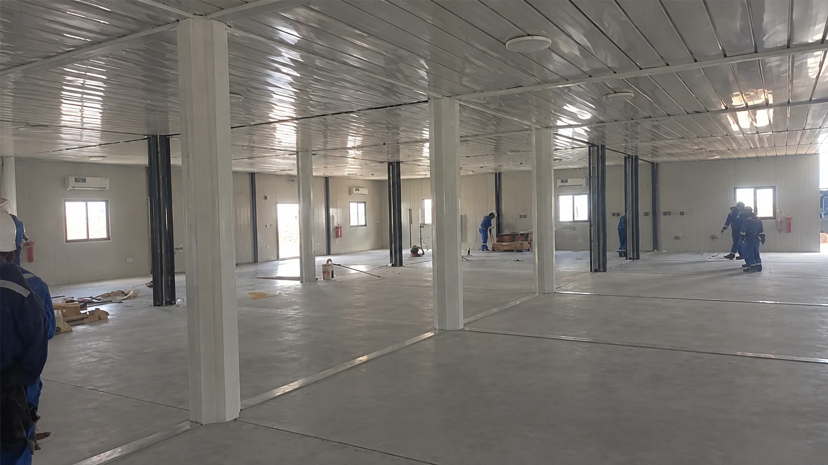 Large modular dining hall interior with columns during construction