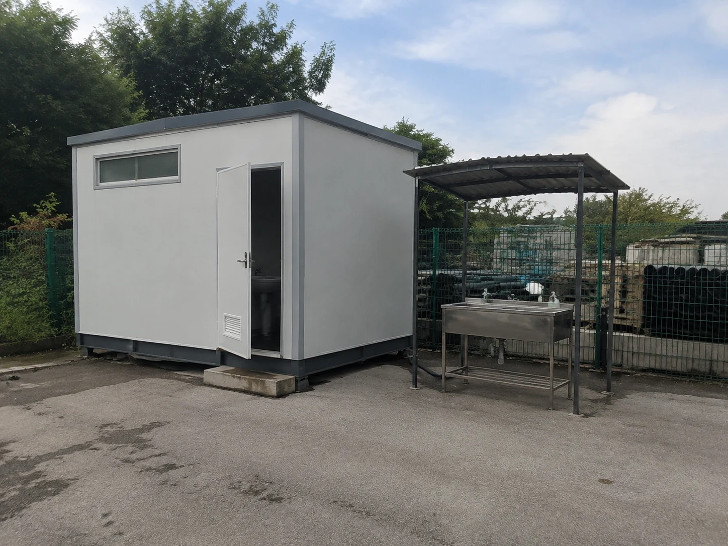 Illustrative prefabricated sanitation cabin at a temporary project service area