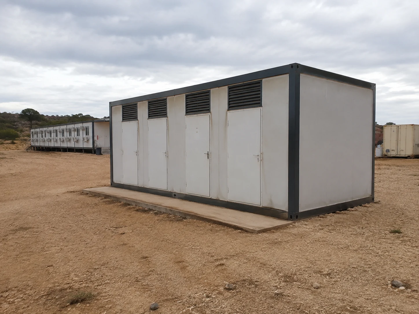 Illustrative shared sanitation block beside worker accommodation