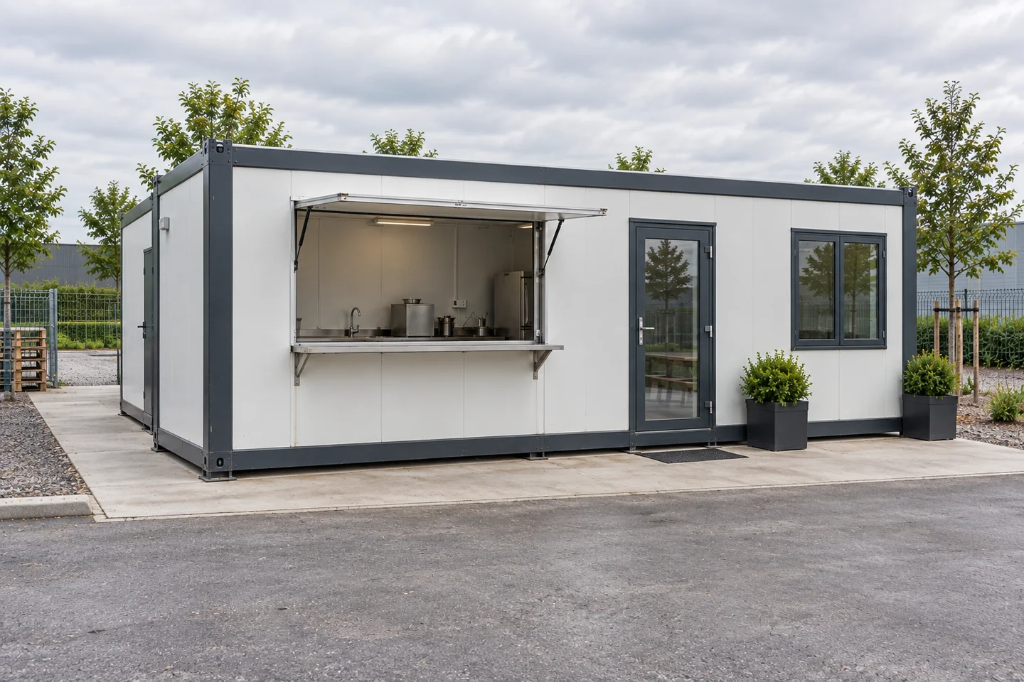 Modular shop beside a level pedestrian approach and service access