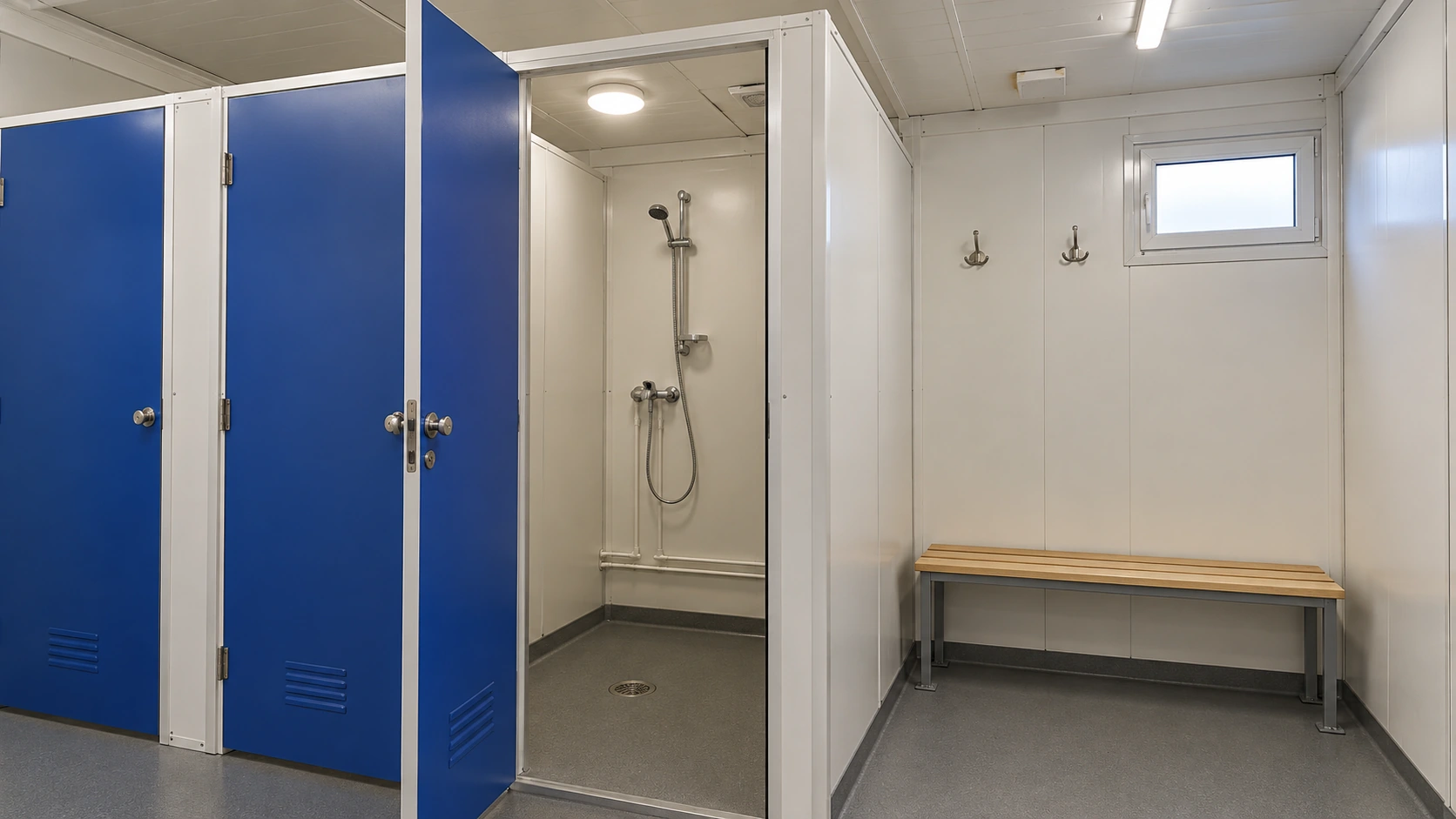Concept of an empty shower cubicle with a plain partition and adjacent dry hooks