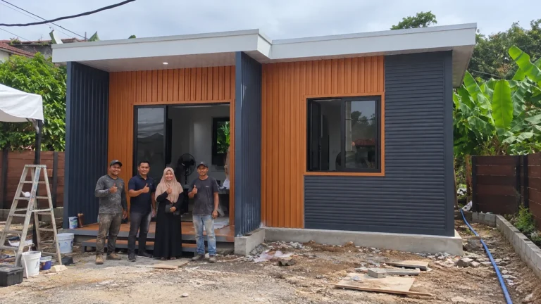 Single-storey clad modular building with people beside the entrance at the Thailand project