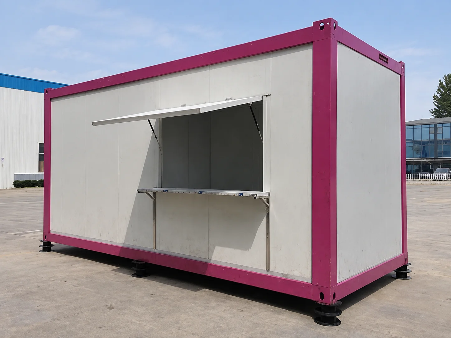 Reference pink-framed kiosk module with an open serving hatch
