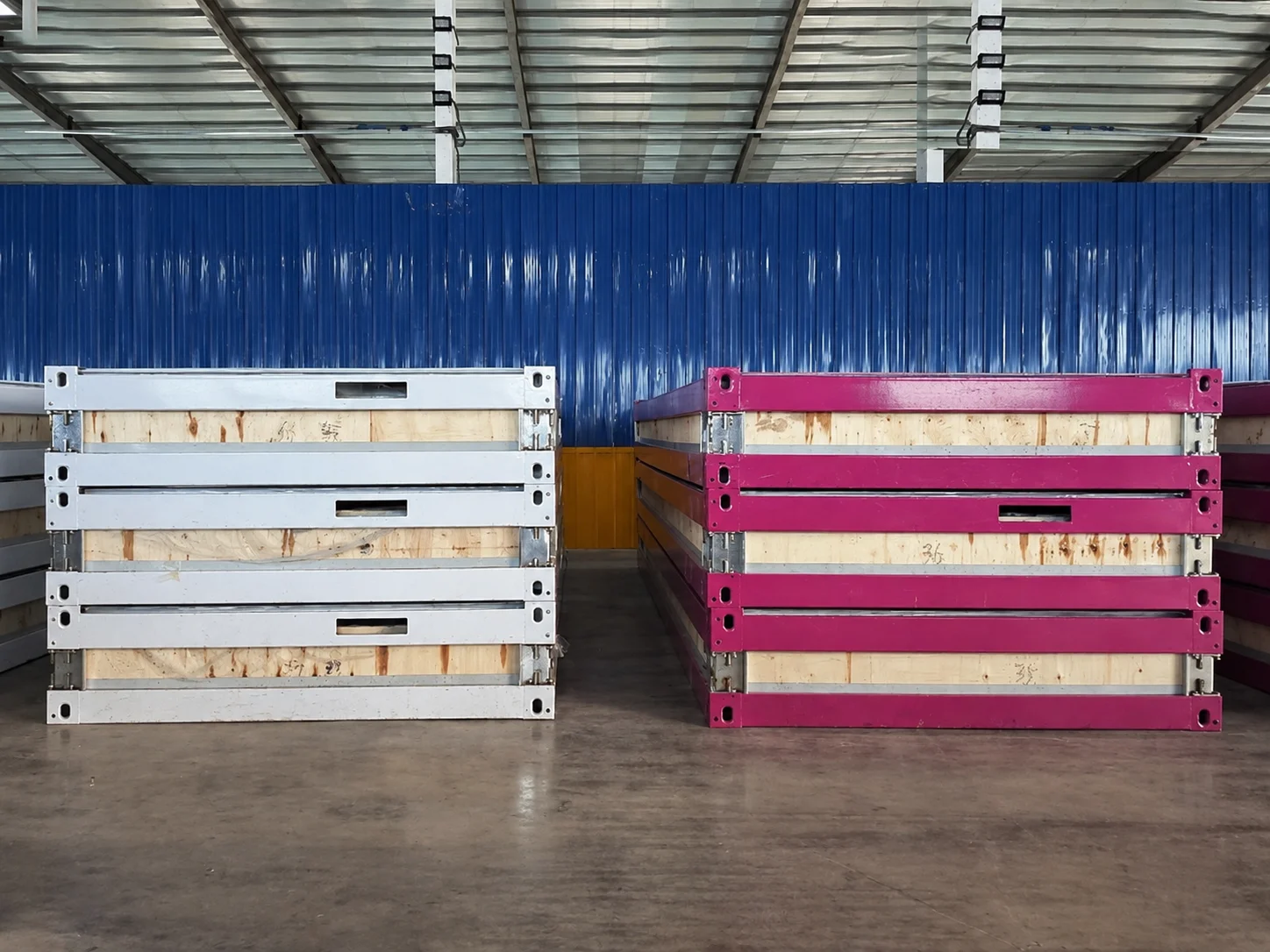 Workshop reference showing stacks of white and pink module frames