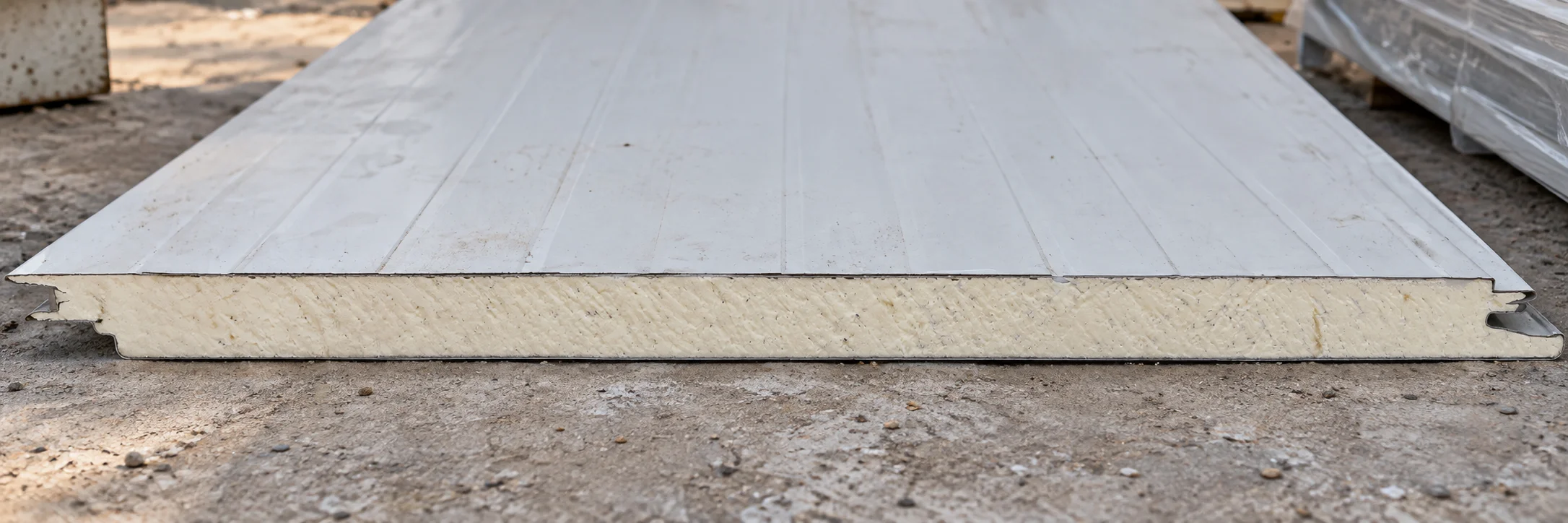 Reference profiled sandwich panel sample with a pale foam-like core