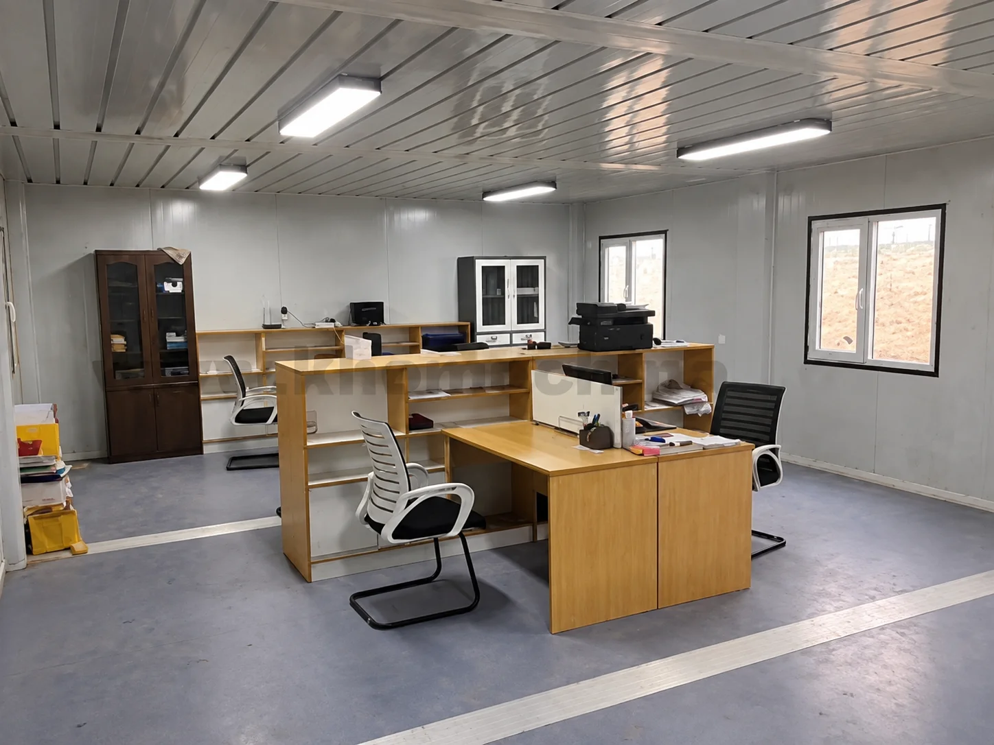 Reference office interior with desks and swivel chairs