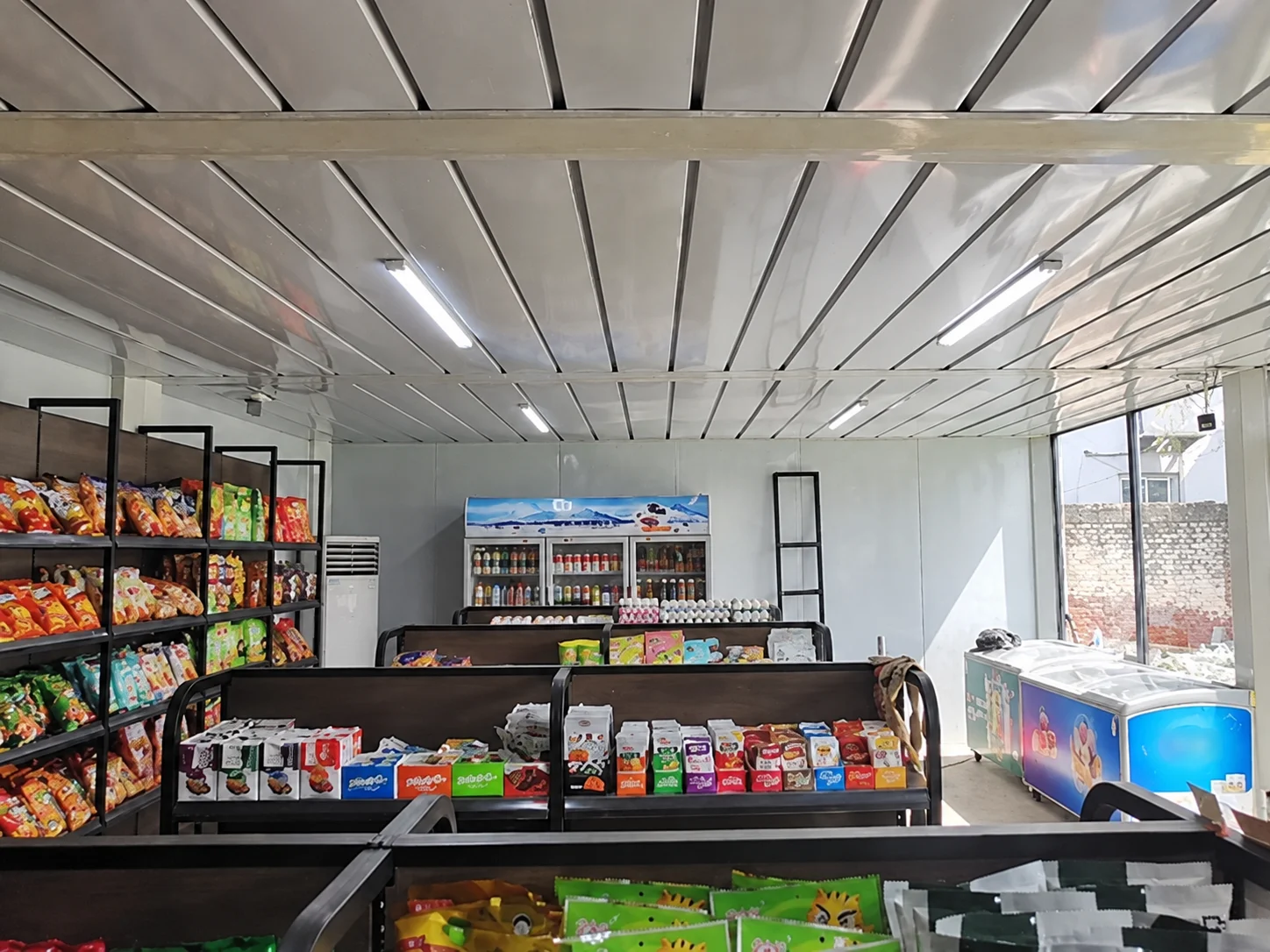 Reference shop interior with shelves and refrigerated displays