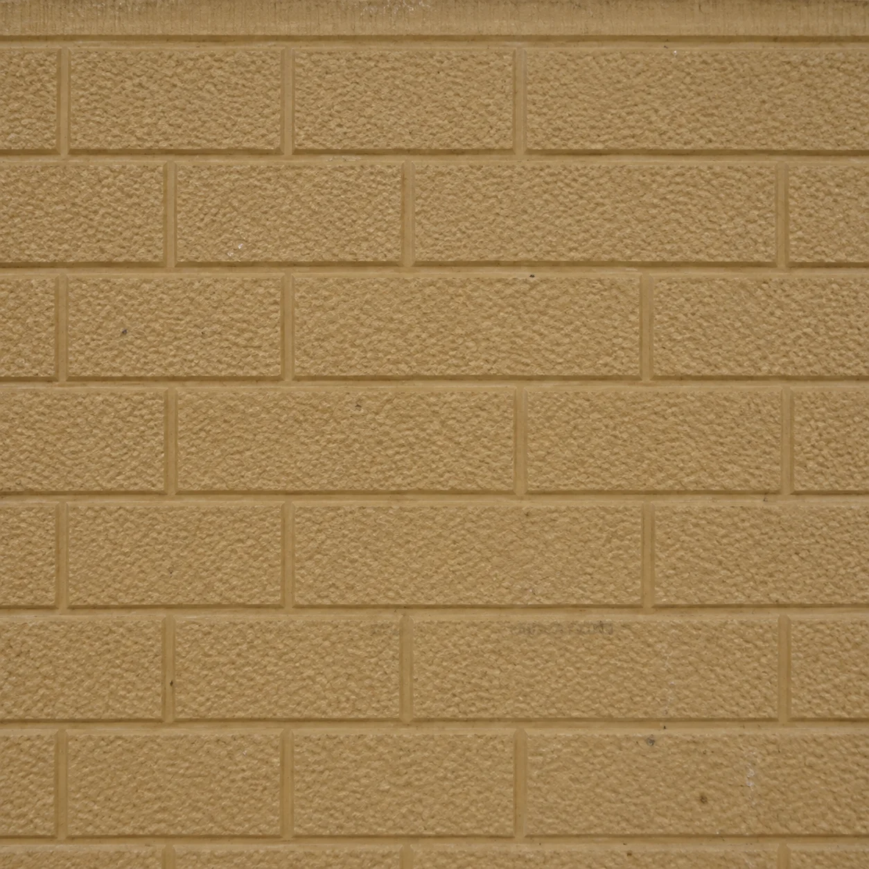 Reference tan brick-pattern exterior panel sample