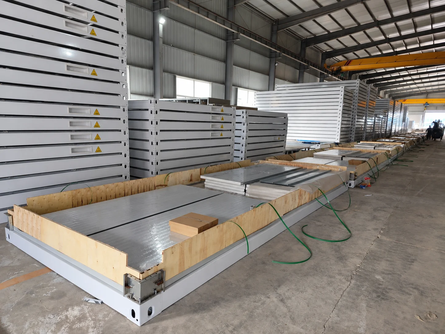 Workshop reference showing a floor assembly with components prepared for packing