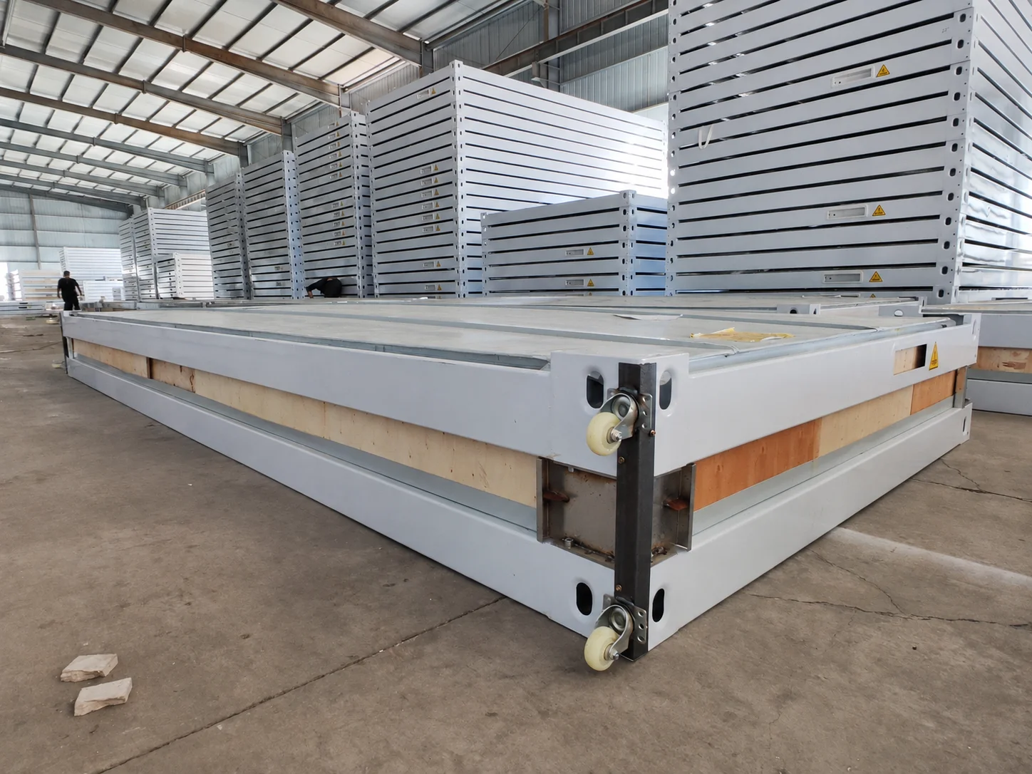 Workshop reference showing a packed module frame beside stacked components