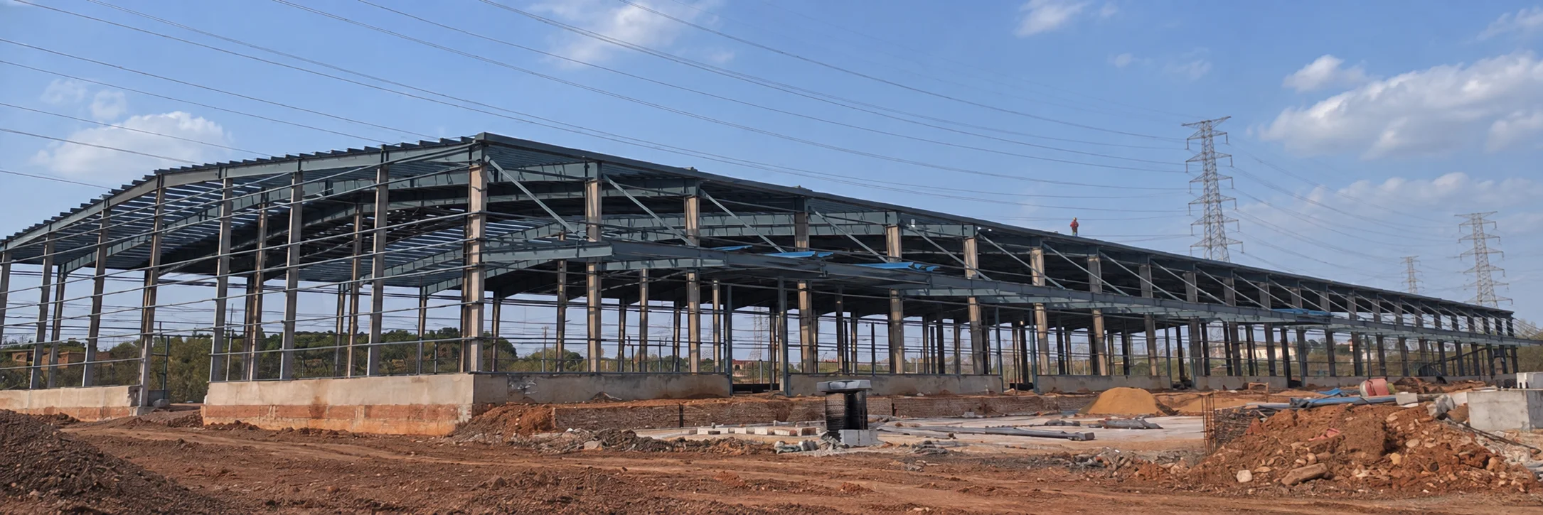 Reference long steel building frame under construction