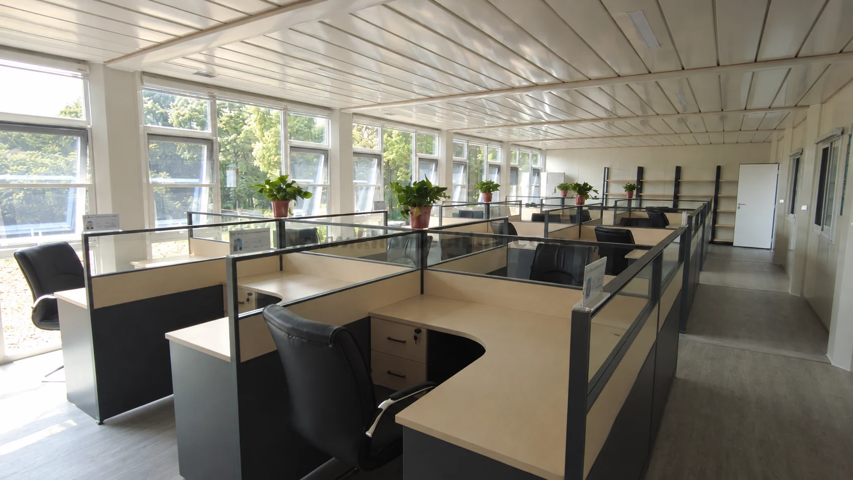 Reference open-plan office interior with desks and low partitions