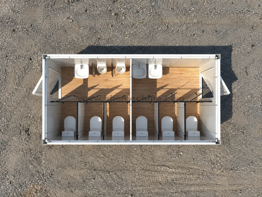 Referenzdarstellung eines modularen Sanitärraumlayouts mit Toilettenkabinen, Urinalen und Handwaschbecken